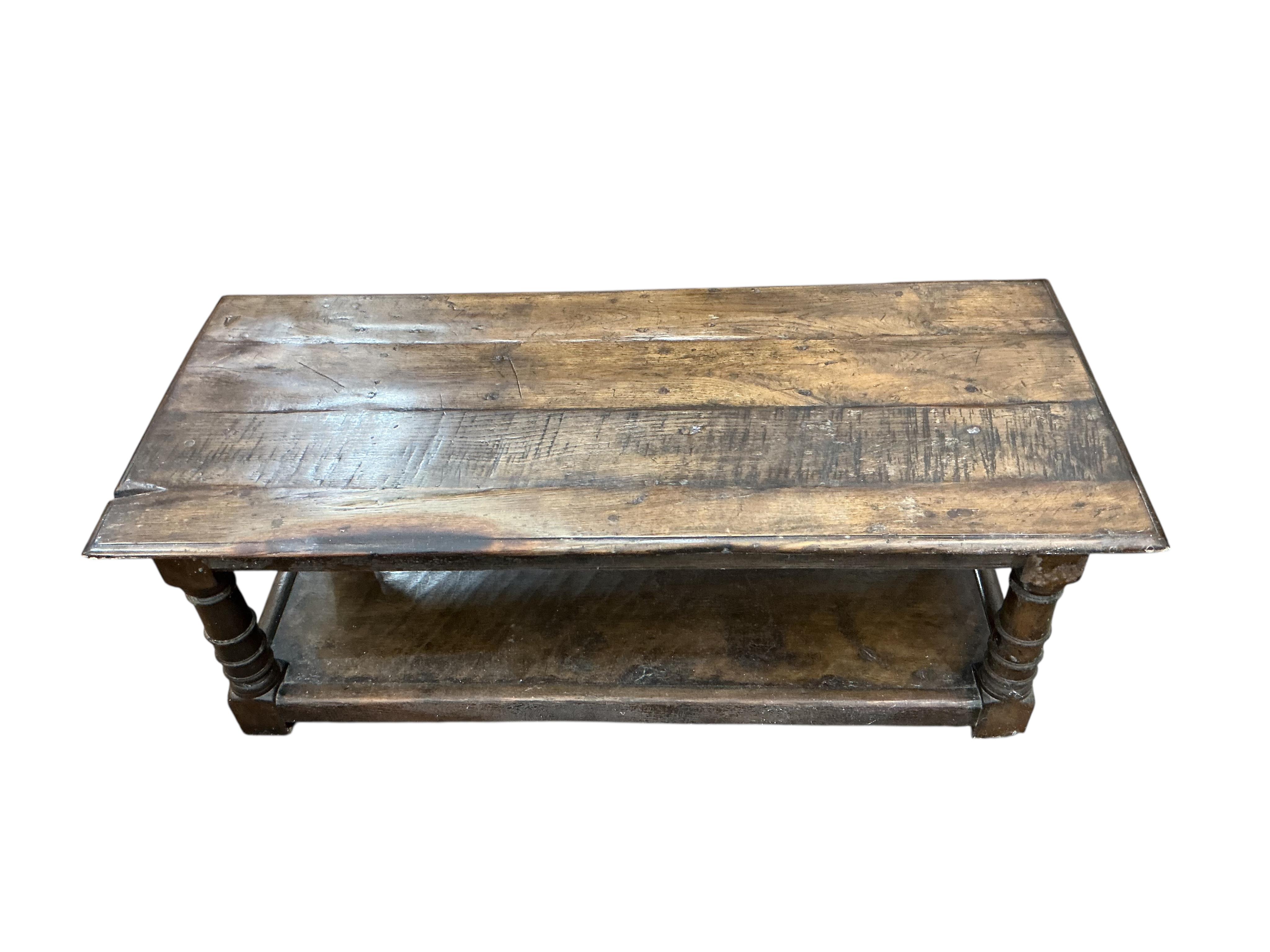 An 18th century style rectangular oak two tier coffee table, width 122cm, depth 50cm, height 43cm